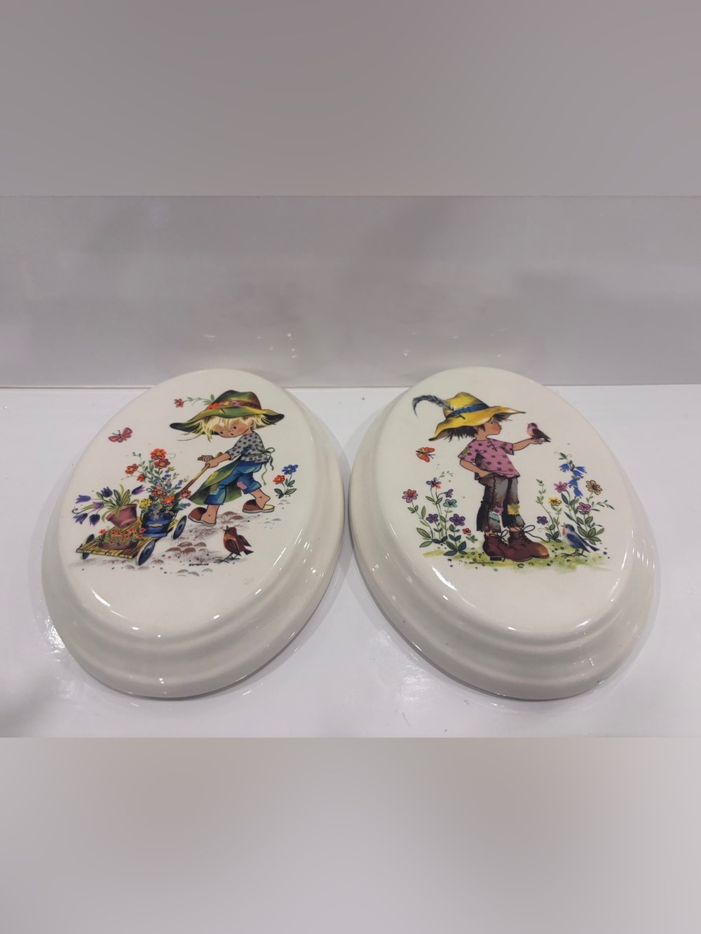 Vintage ceramic wall plaque pair-children &floral design - 7”
